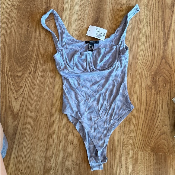 Baby blue body suit from Forever 21. Never worn. Size M - Picture 4 of 4